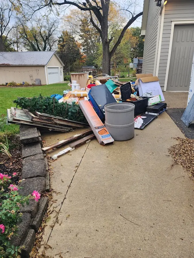 Dumpster being loaded with debris for Demolition Dumpster Rental in Piedmont